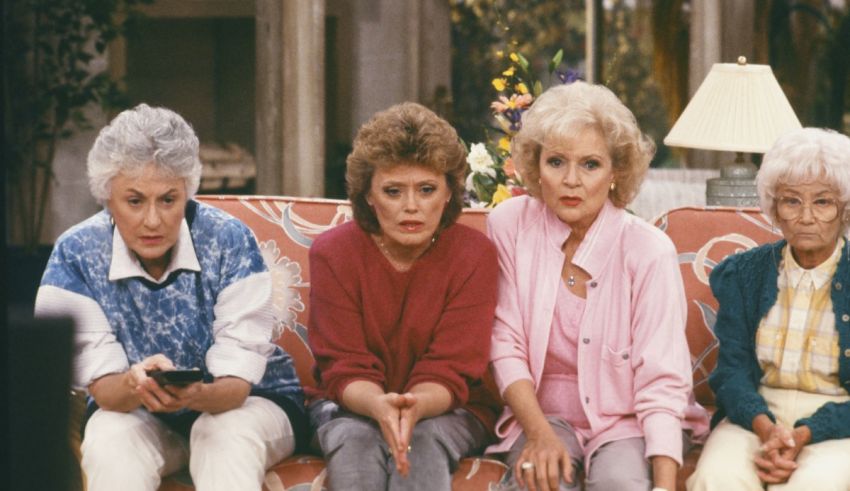 A group of women sitting on a couch.