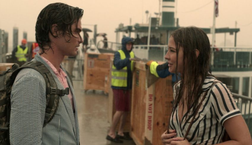 A man and woman standing next to each other on a boat.
