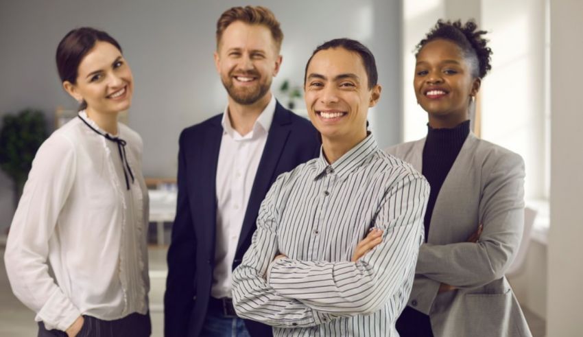 A group of business people posing for a photo.