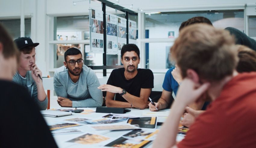 A group of people sitting around a table.