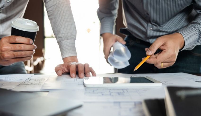 Two businessmen are working on a project together.
