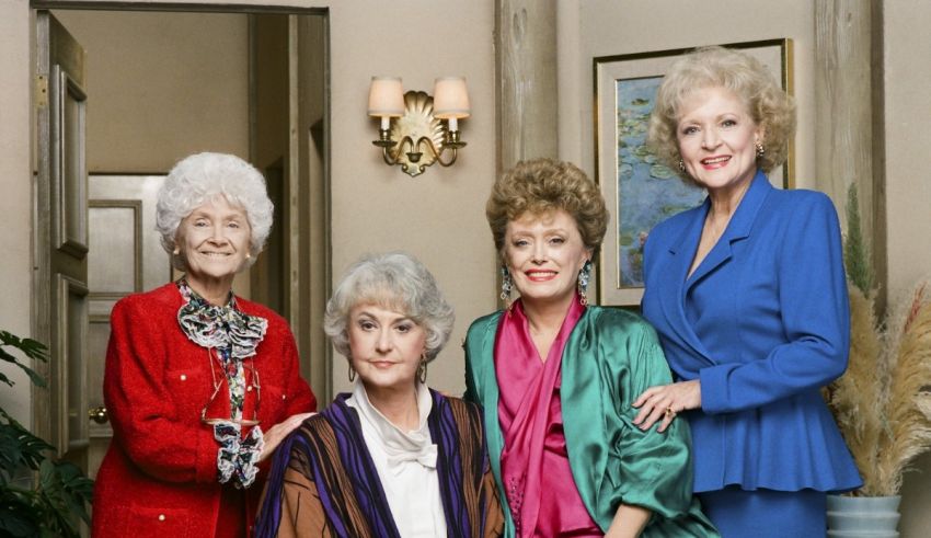 The golden girls are posing for a picture.