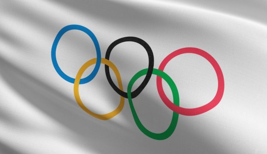 The olympic rings on a white flag.