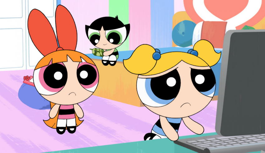 The powerpuff girls are sitting in front of a computer.