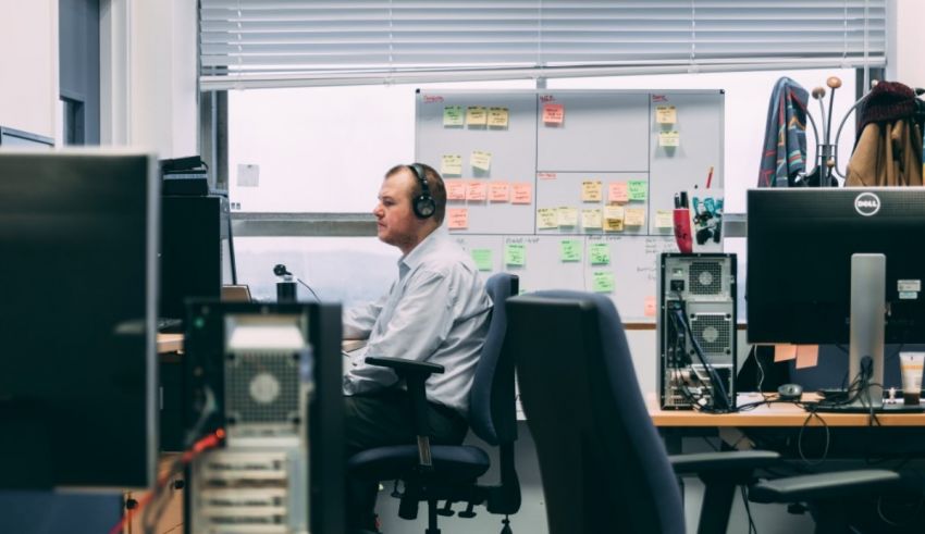 A man working at a desk in an office.