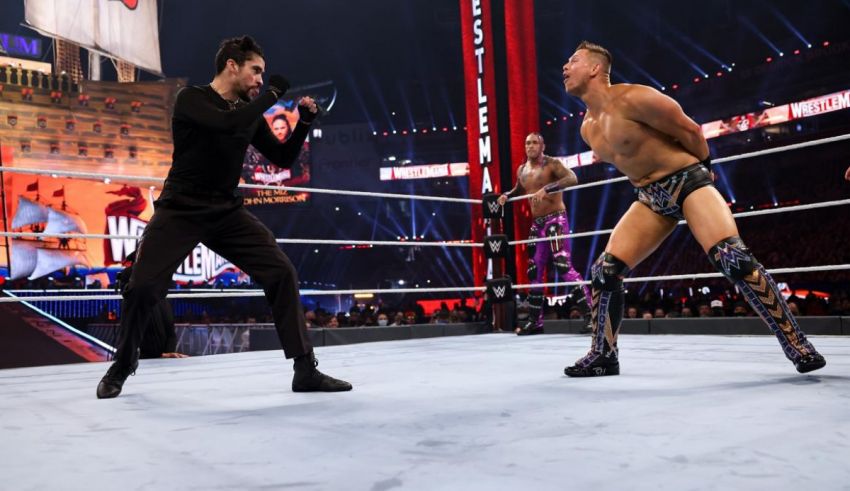 Two wrestlers are fighting in a wrestling ring.