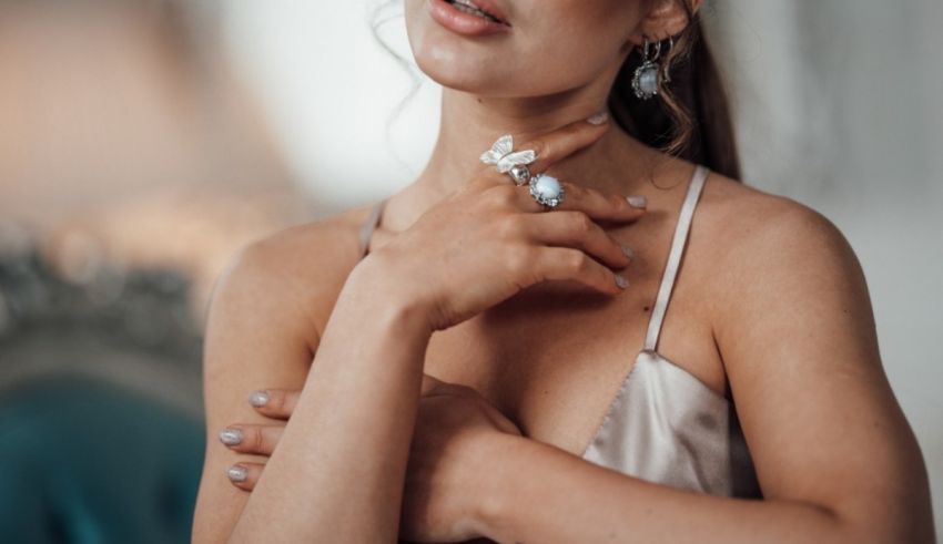 A woman is posing with a ring on her finger.