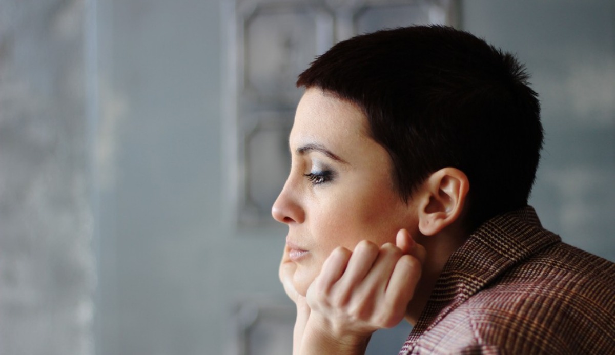 head shot portrait of a woman short hair side view