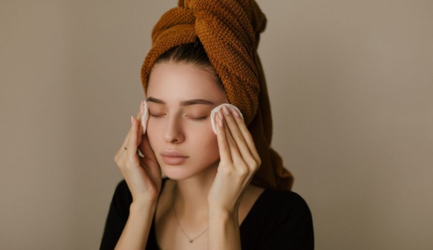 A woman with a towel covering her face.