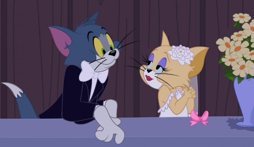A cartoon cat and a woman are sitting at a table.