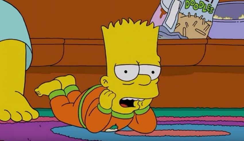 A simpsons character is laying on the floor.