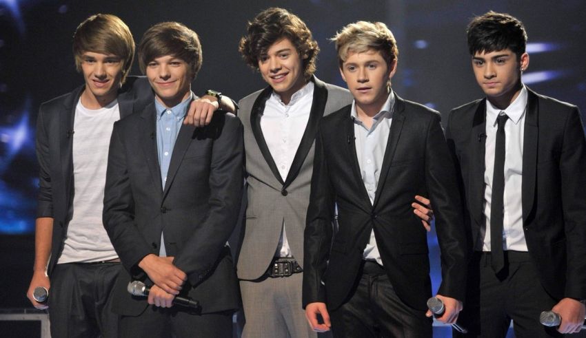 One direction on stage at the british olympics.