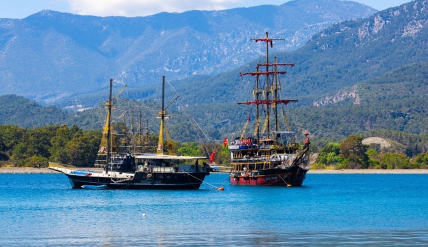 Two sailboats docked in a body of water.