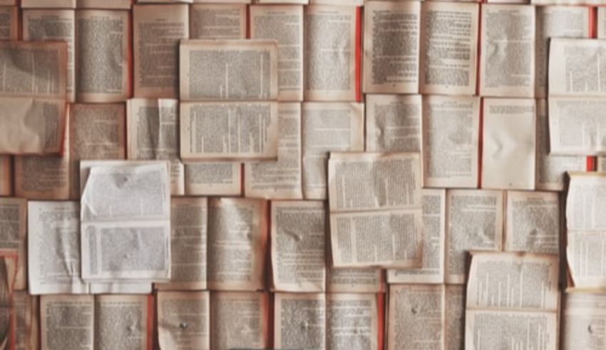 A wall of books on a table.