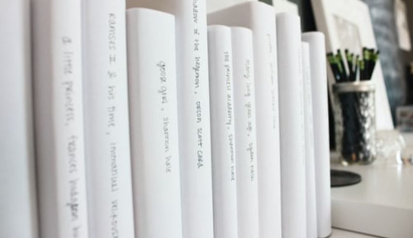 A stack of white books on a shelf.