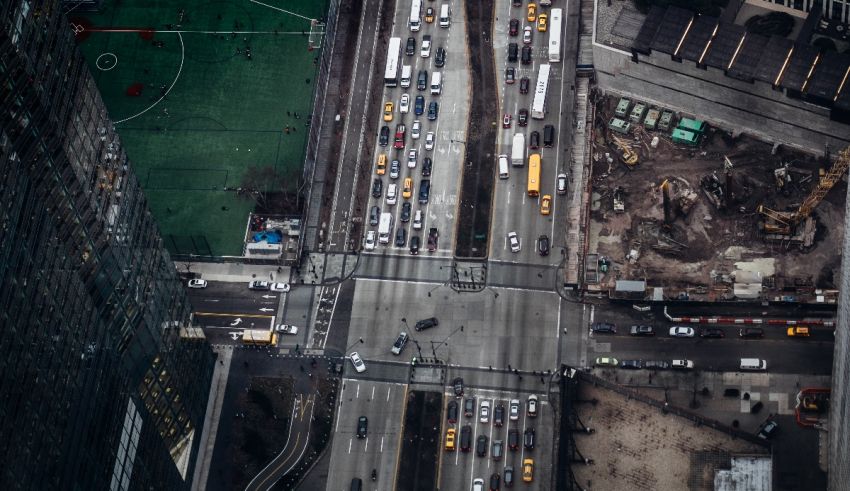 Aerial view of a busy street with many cars.