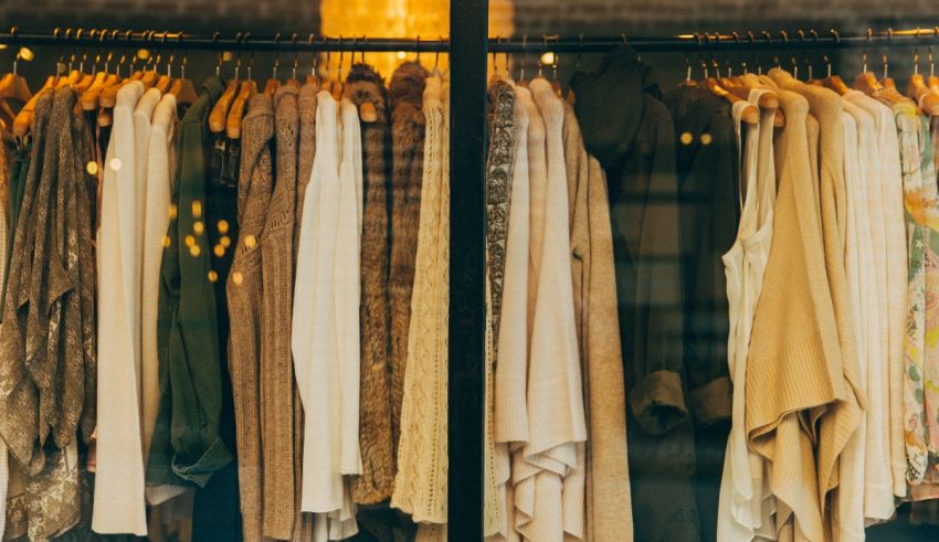 An image of clothes hanging on a rack in a store.