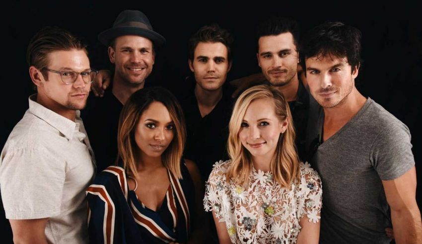 The vampire diaries cast posing for a photo.