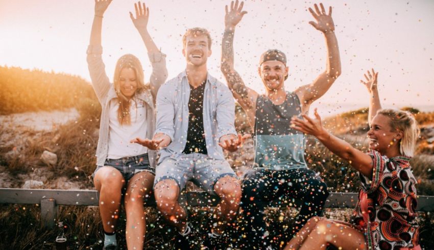 A group of friends throwing confetti at each other.