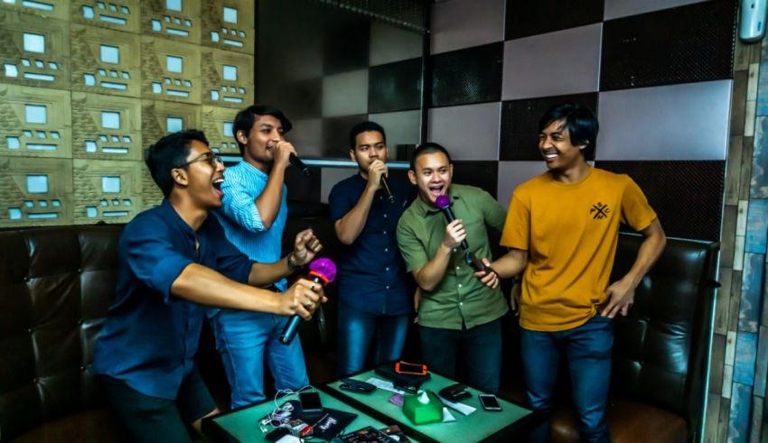 A group of men standing in a room with microphones.