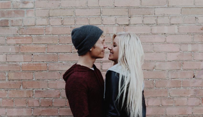 A man and woman looking at each other.