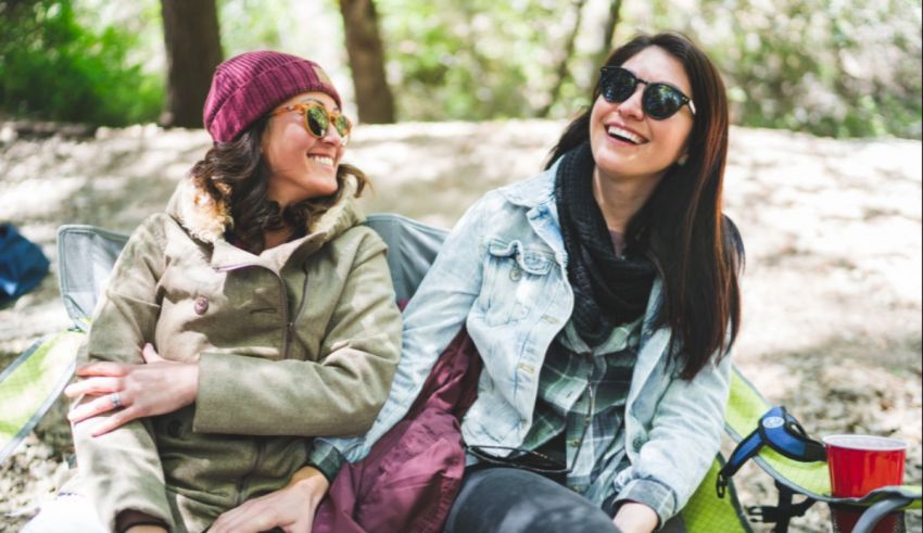 Two women sitting on a bench.