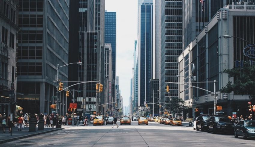A street with cars and buildings.