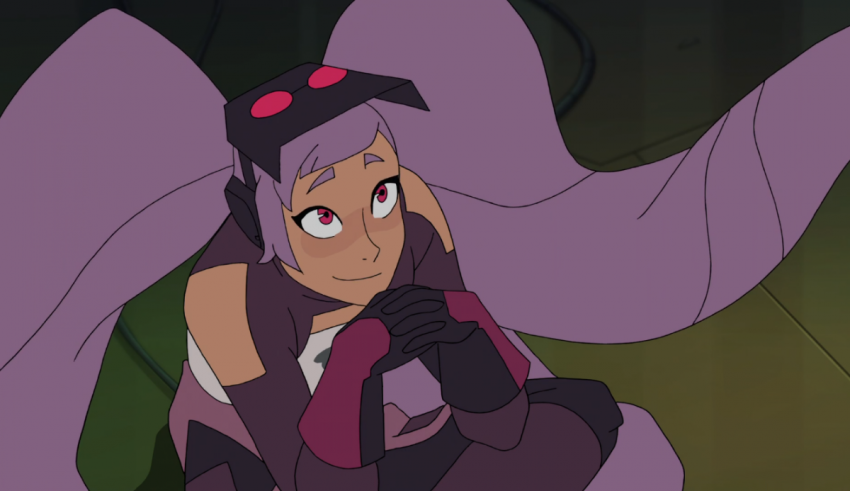 A girl with purple hair sitting on the ground.