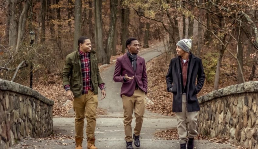 A group of men walking on a path in the woods.