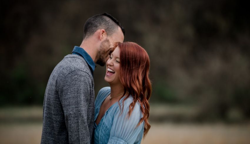 A man and woman laughing.