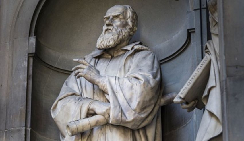 A statue of a man with a beard in front of a building.
