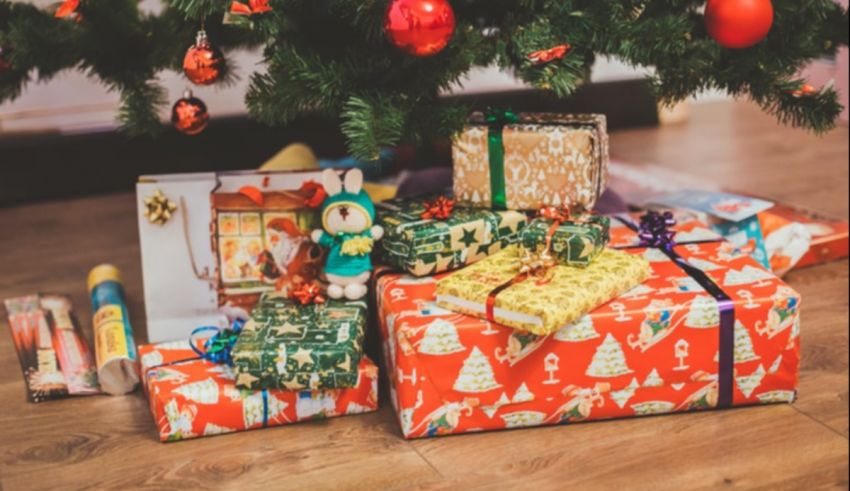 Christmas presents under a christmas tree.