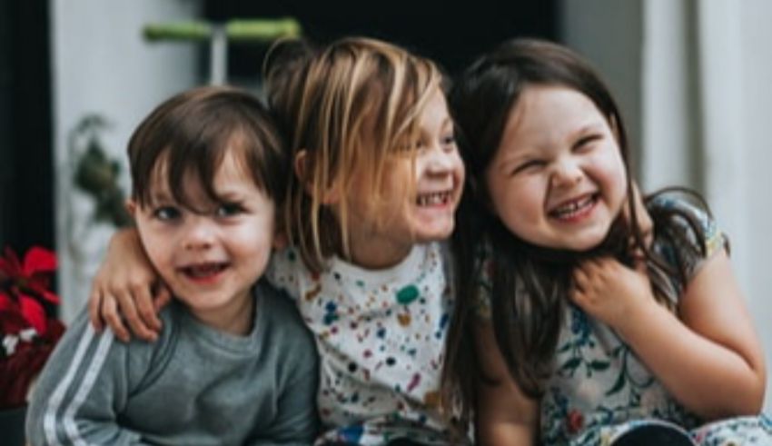 A group of children smiling.