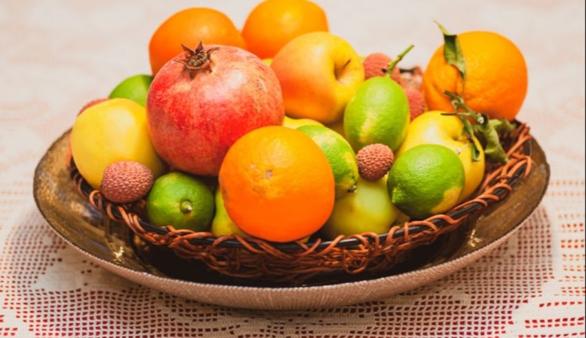 A bowl of fruit on a table.