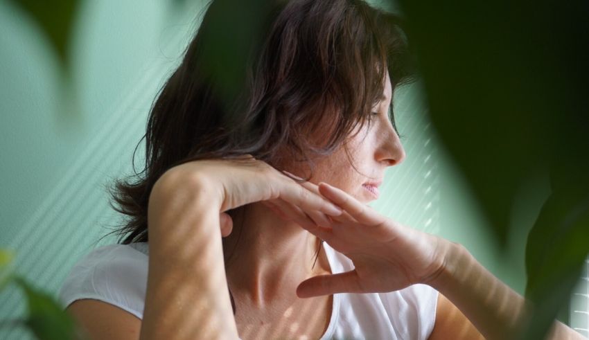 A woman with her hands on her face.