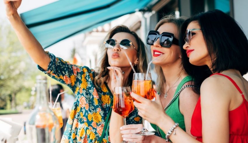 A group of women holding drinks.