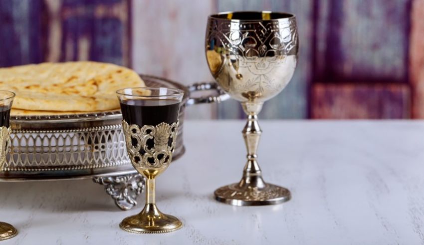 A silver and gold wine glasses.