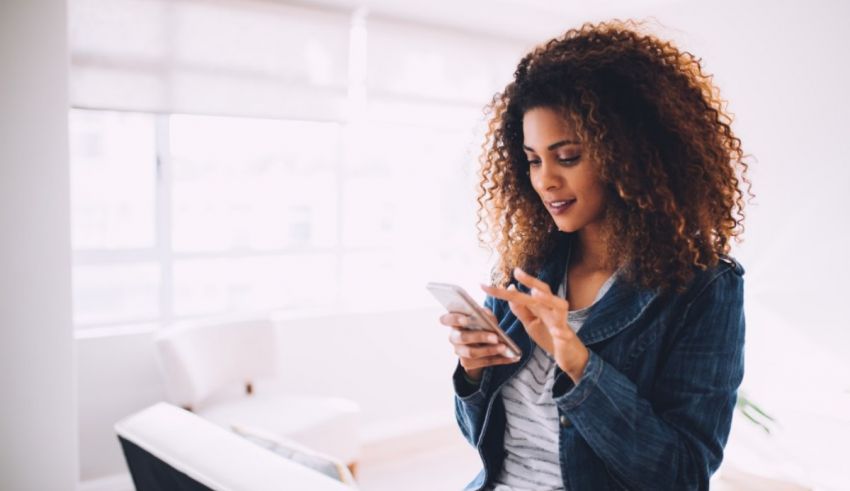 A woman holding a phone.