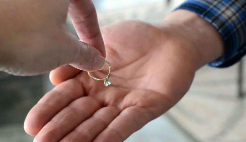 A person holding a ring in their hand.