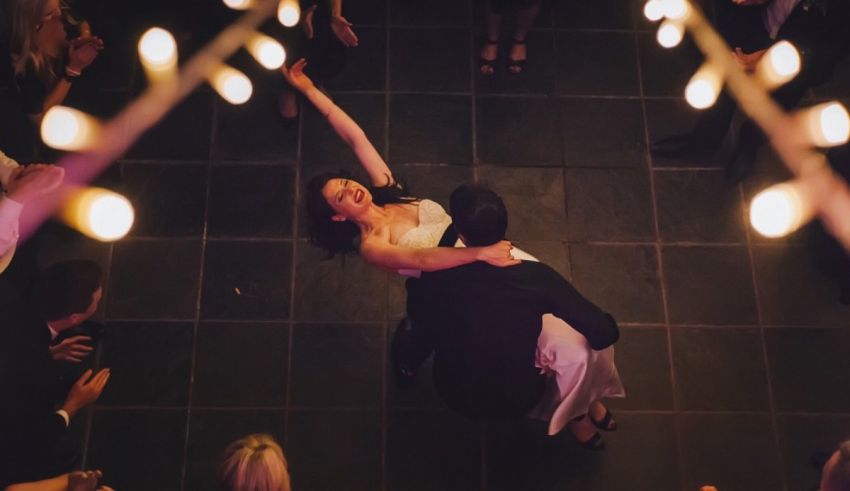 A bride and groom dancing at a wedding reception.