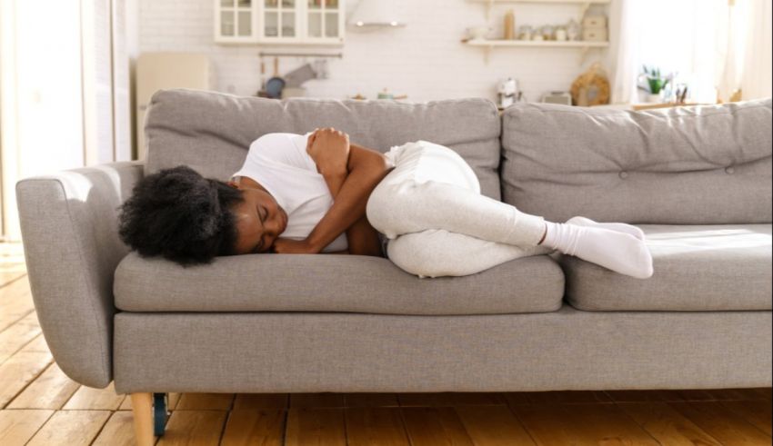 A woman lying on a couch.