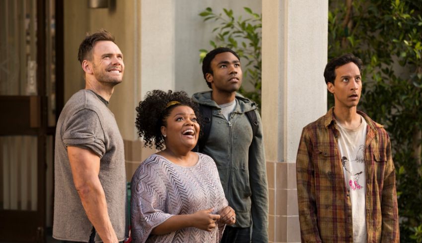 A group of people standing outside a building.