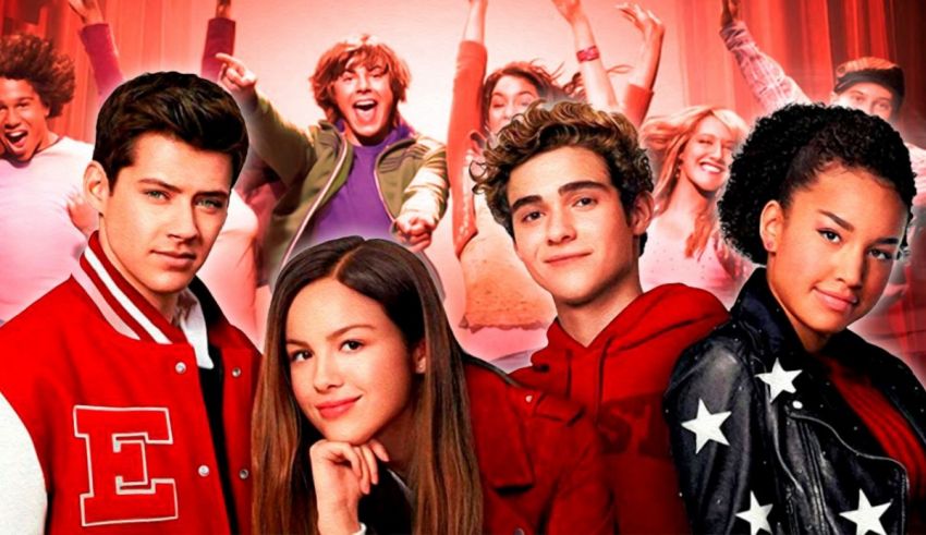 A group of people posing in front of a red background.