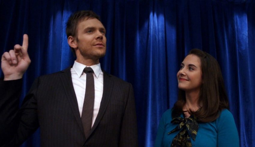 A man and woman looking at each other.