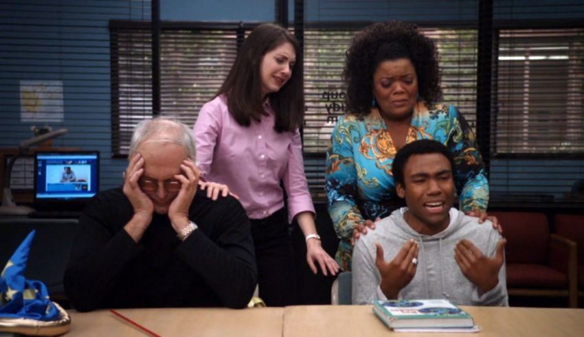 A group of people sitting around a table.