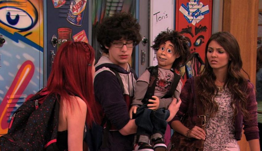 A group of people with red hair standing in front of a locker.