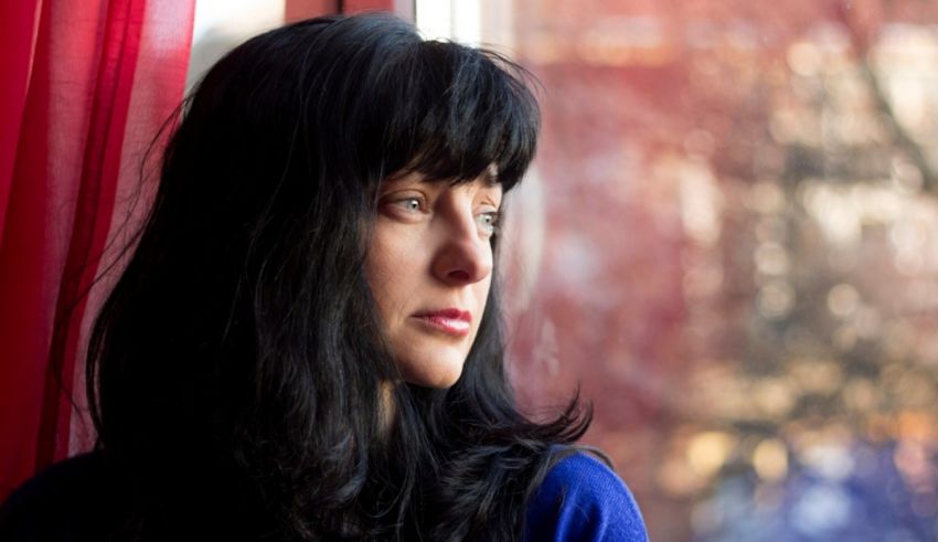 A woman looking out of a window.