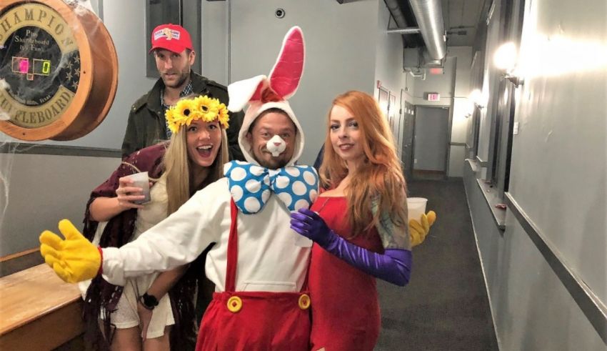 A group of people dressed in bunny costumes posing for a photo.
