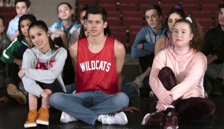 A group of people sitting on the floor.