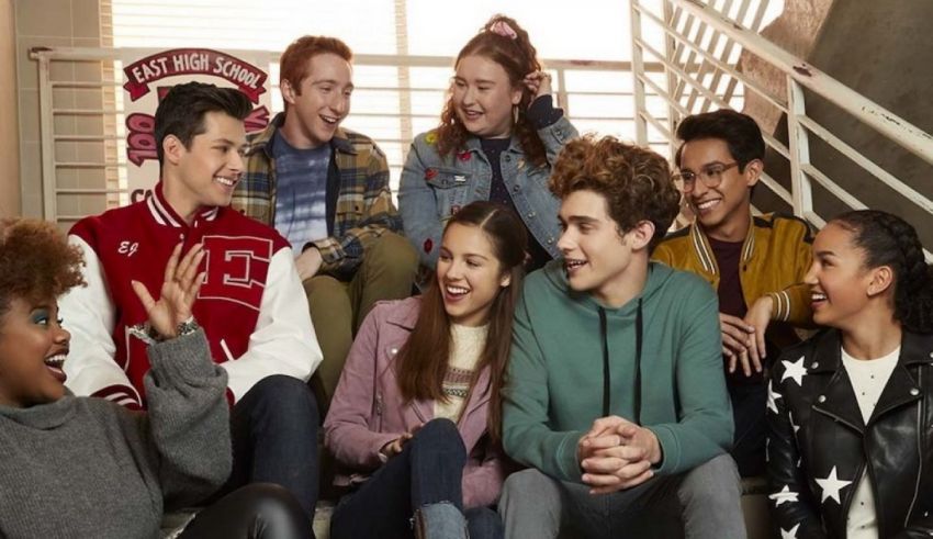A group of young people sitting on stairs.